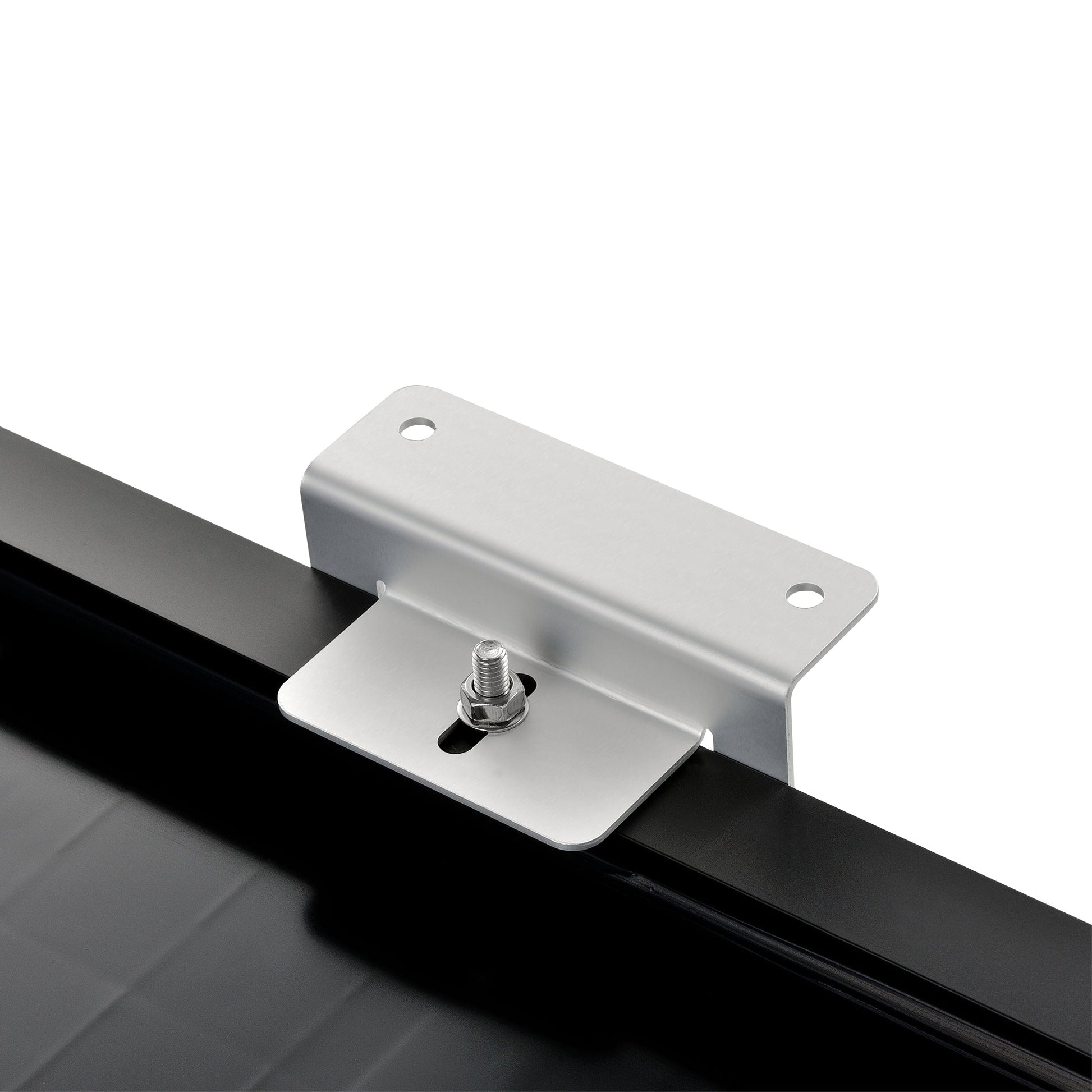 Z-brackets holding a solar panel above a flat roof surface